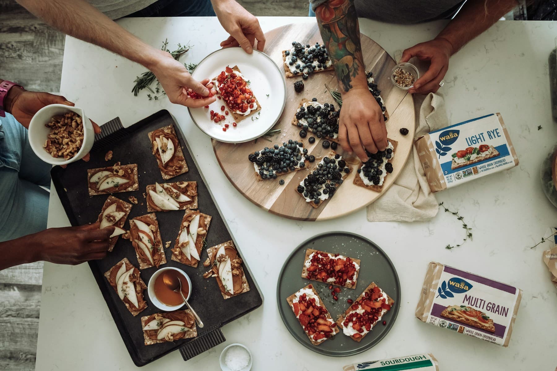 Guests sharing a selection of dishes around a restaurant table
